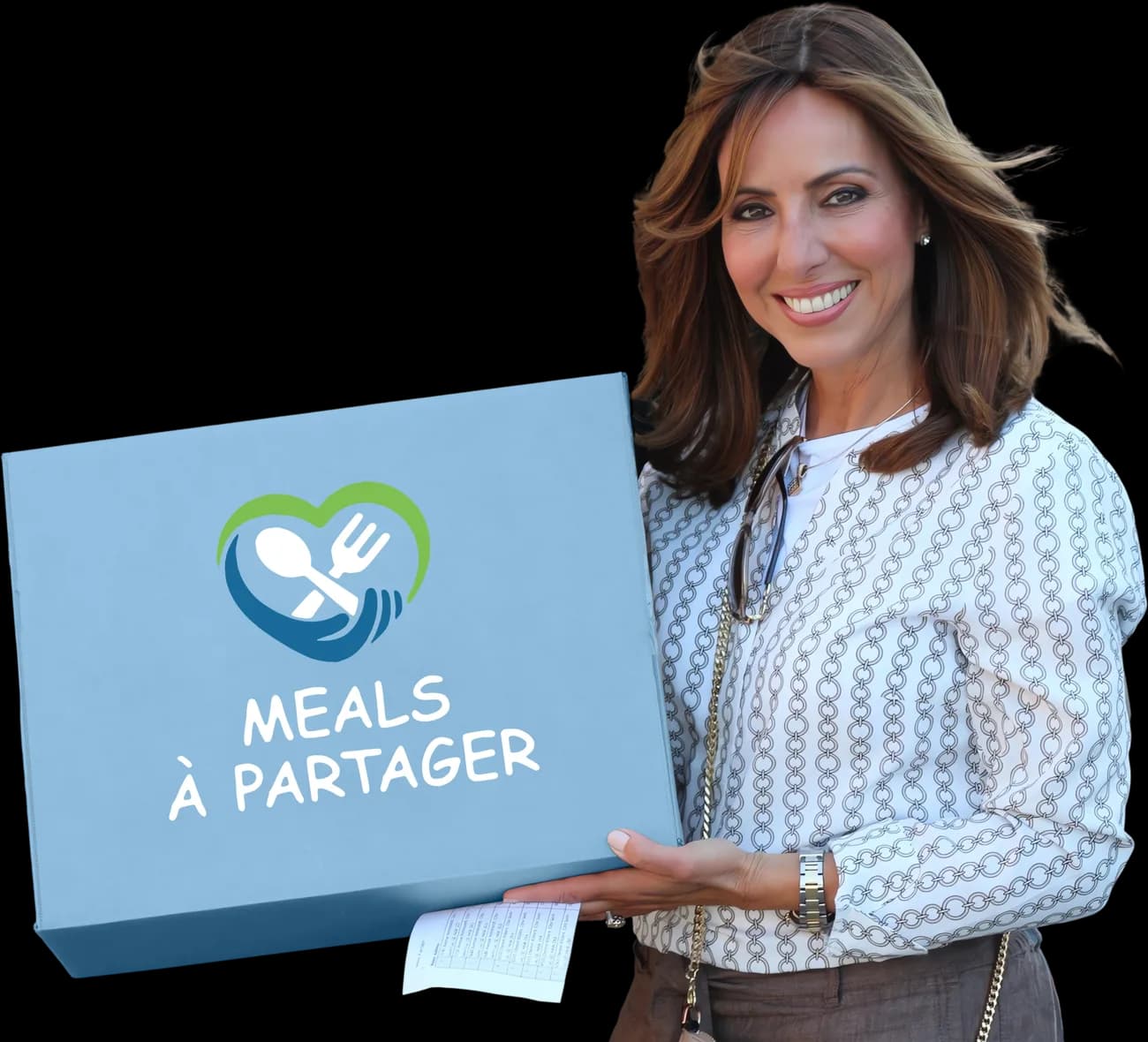 Bénévole de MADA tenant une boîte de livraison Meals à Partager